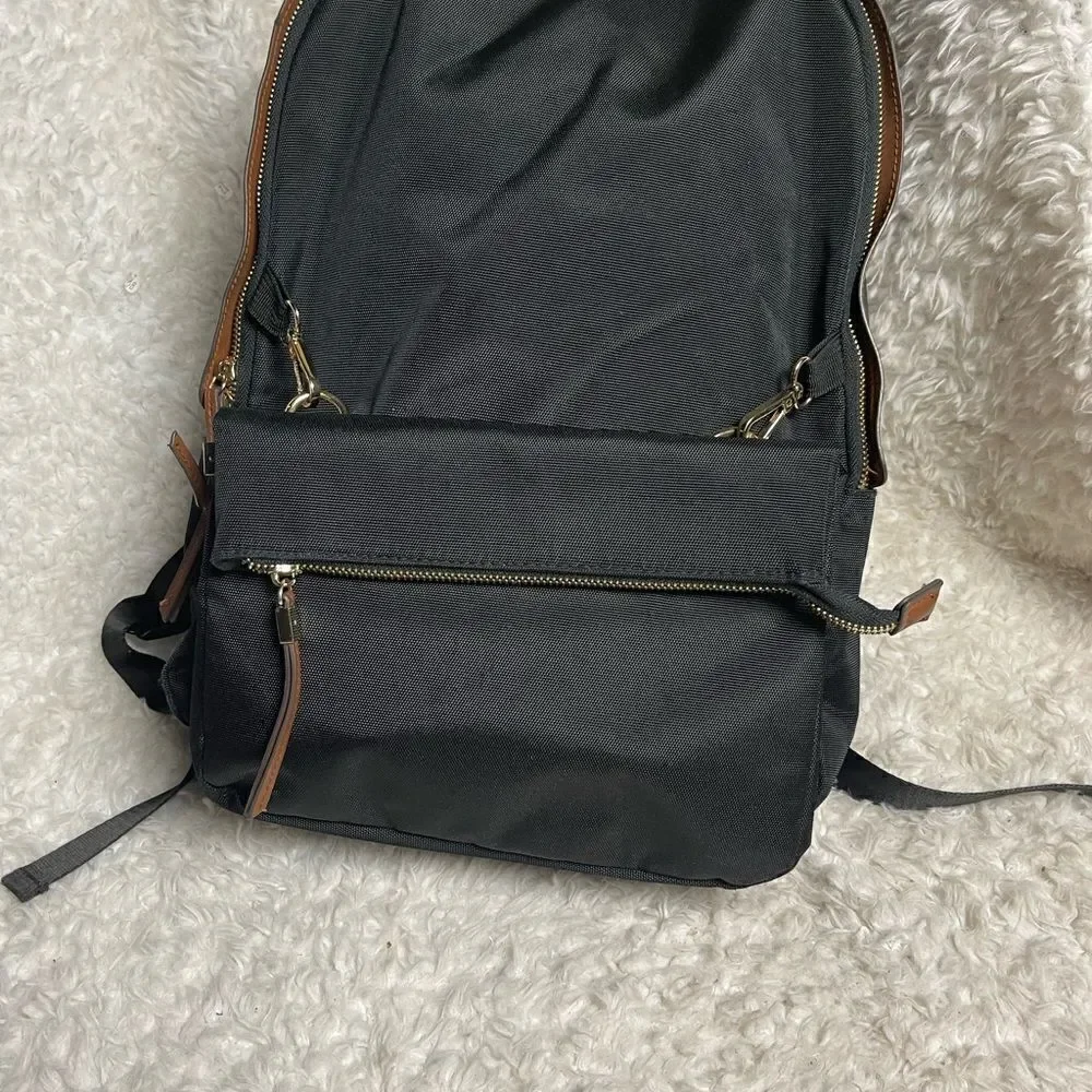 Tommy Bahama Black Laptop Case Backpack With Brown trims and straps .